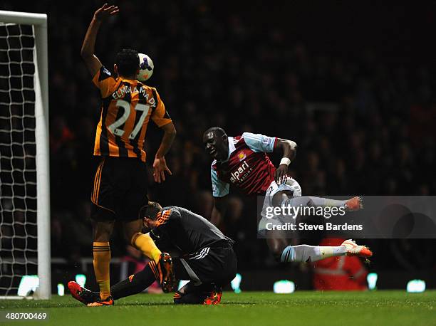 Ahmed Elmohamady of Hull City appeals as Allan McGregor of Hull City brings down Mohamed Diame of West Ham in the area during the Barclays Premier...