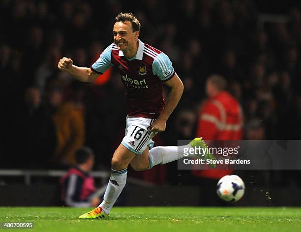 Mark Noble of West Ham celebrates scoring the opening goal from the penalty spot during the Barclays Premier League match between West Ham United and...