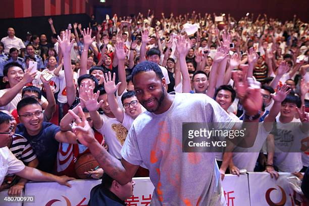 American retired professional basketball player Tracy McGrady meets fans at Outlets Plaza on July 14, 2015 in Taizhou, China.