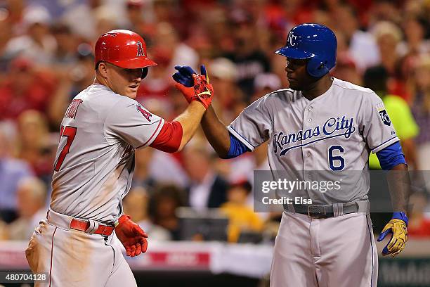 American League All-Star Mike Trout of the Los Angeles Angels of Anaheim celebrates with teammate Lorenzo Cain of the Kansas City Royals after scoing...