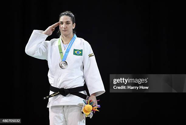 Mayra Aguiar of Brazil stands as a National Anthem is played after winning a silver medal in the minus 100kg judo during the 2015 Pan Am games at the...