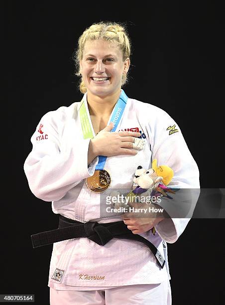Kayla Harrison of the United States of America celebrates her gold medal win over Mayra Aguiar of Brazil in the minus 100kg judo gold medal match...