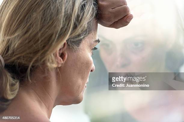 pensive woman - social exclusion stock pictures, royalty-free photos & images