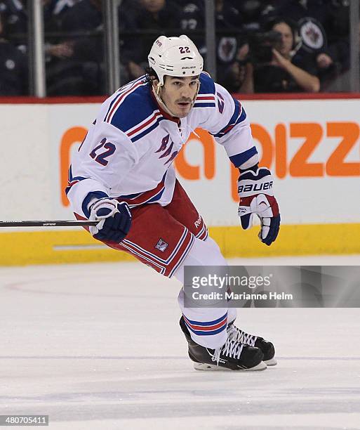 Brian Boyle of the New York Rangers skates down the ice during second period action in an NHL game against the Winnipeg Jets at the MTS Centre on...