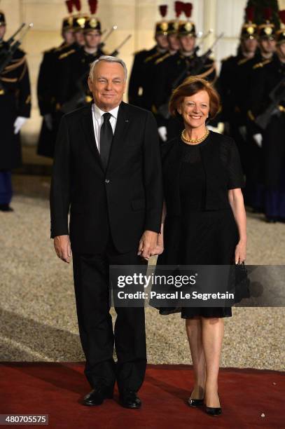 French Prime Minister Jean-Marc Ayrault and his wife Brigitte Ayrault arrive at the Elysee Palace for an official dinner hosted by French President...