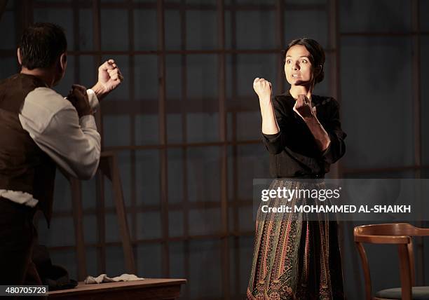 Actors Fanos Xenofs and Dina Mousawi perform in a play titled "Rest Upon The Wind" commemorating the life and times of legendary Lebanese poet and...