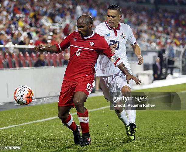 Julian De Guzman of Canada and David Guzman of Costa Rica battle for the ball during the 2015 CONCACAF Gold Cup Group B match between Canada and...
