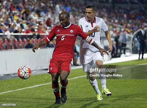 Julian De Guzman of Canada and David Guzman of Costa Rica battle for the ball during the 2015 CONCACAF Gold Cup Group B match between Canada and...