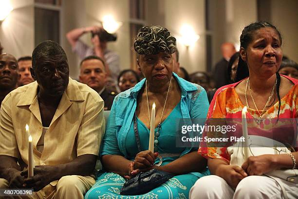 Eric Garner's stepfather, Benjamin Carr, mother Gwen Carr and his widow Esaw Garner attend an interfaith prayer service at Mount Sinai United...