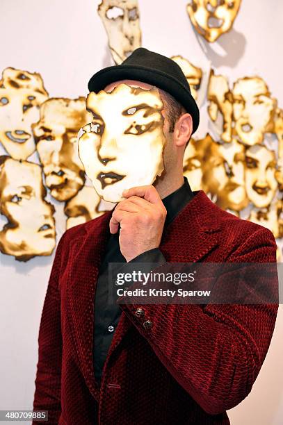 Igor Josifov poses with his art during the Paris Art Fair at Le Grand Palais on March 26, 2014 in Paris, France.