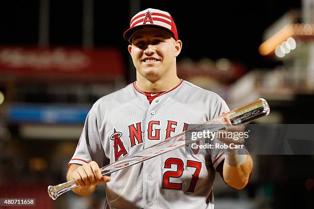 American League All-Star Mike Trout of the Los Angeles Angels of Anaheim poses with the MVP trophy after defeating the National League 6 to 3 in the...
