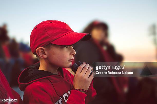 boy watching football game - サッカー　観客 ストックフォトと画像
