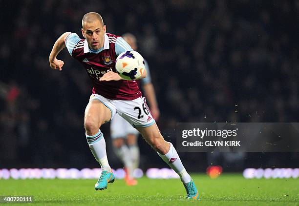 West Ham United's English midfielder Joe Cole runs after the ball during the English Premier League football match between West Ham United and Hull...