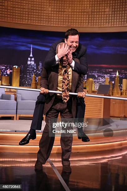 Episode 0028 -- Pictured: Comedian Bill Cosby walks a tightrope with a little help from host Jimmy Fallon on March 26, 2014 --