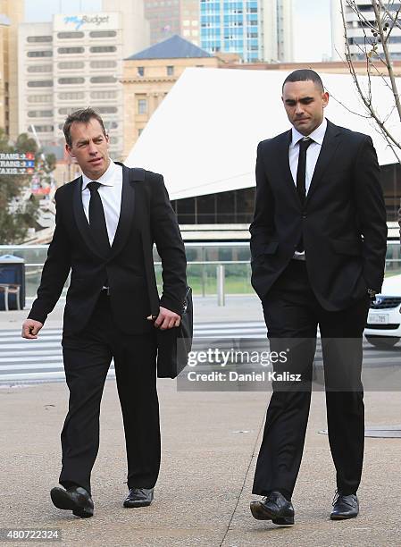 Hawks head coach Alastair Clarkson and Shaun Burgoyne of the Hawks arrive at the memorial for Phil Walsh service at the Adelaide Oval on July 15,...