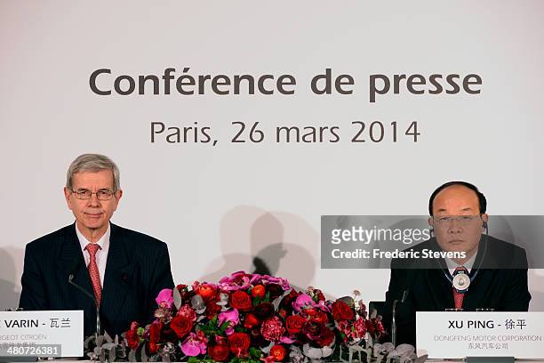 Philippe Varin , chairman of the PSA Peugeot Citroen, and Xu Ping, chairman of the board of directors of Dongfeng, attend a news conference on March...