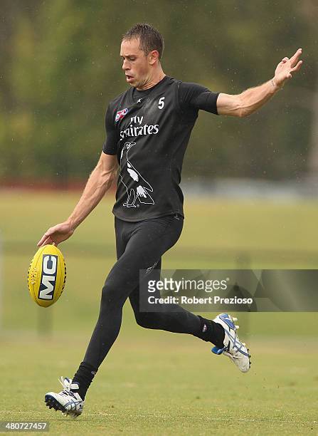 Nick Maxwell kicks the ball during a Collingwood Magpies AFL training session at Westpac Centre on March 27, 2014 in Melbourne, Australia.