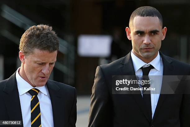 Tigers head coach Damien Hardwick and Shaun Burgoyne of the Hawks leave after the memorial for Phil Walsh service at the Adelaide Oval on July 15,...