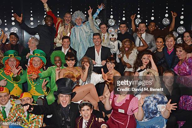 Producer Simon Cowell poses with the cast backstage following the press night performance of "I Can't Sing! The X Factor Musical" at the London...