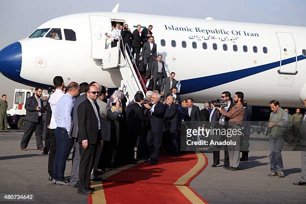 Iranian Foreign Minister Mohmmad Javad Zarif and members of Iran's negotiation team arrive at the Mehrabad International Airport on July 15, 2015 in...