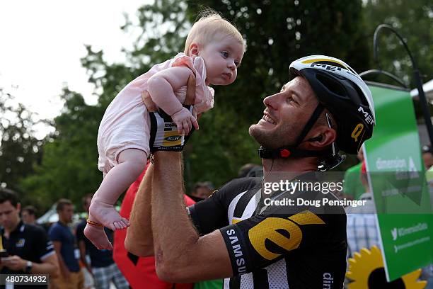 Stephen Cummings of Great Britain and MTN-Qhubeka holds his daughter before the start of stage eleven of the 2015 Tour de France, a 188 km stage...