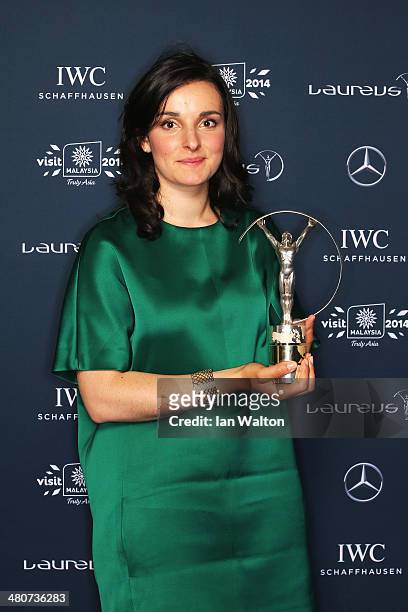 Skier Marie Bochet winner of the Laureus World Sportsperson of the Year with a Disability award poses with their trophy during the 2014 Laureus World...