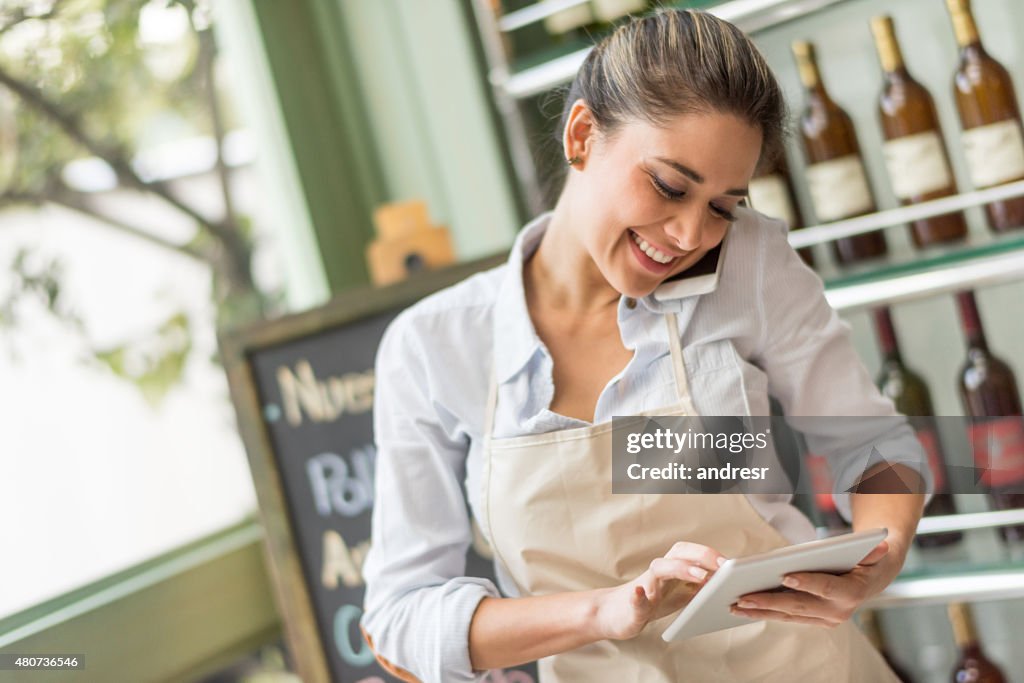 Busy woman working at a restaurant multitasking