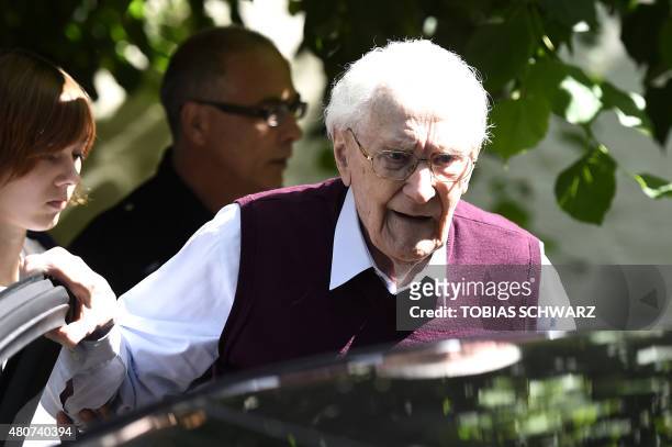 Convicted former SS officer Oskar Groening leaves after the verdict in his trial on July 15, 2015 at court in Lueneburg, northern Germany. Oskar...