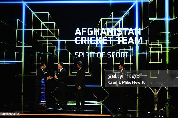 Doctor Noor Mohammad Murad on behalf of the Afghanistan Cricket team is given the Laureus Spirit of Sport Award by Laureus Academy members Kapil Dev...