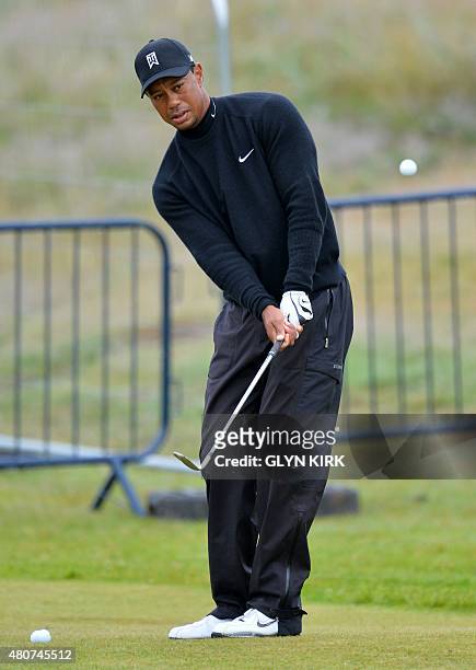 Golfer Tiger Woods practices his chipping on the practice ground on The Old Course at St Andrews in Scotland, on July 15 ahead of The 2015 Open Golf...