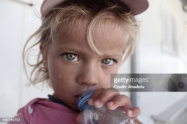 Syrian child at a refugee camp in Suruc district of Sanliurfa on July 14 as the Syrian Kurds who fled the clashes between Daesh and Kurdish armed...