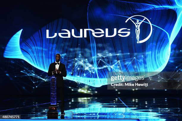 Laureus Academy member Michael Johnson speaks on stage during the 2014 Laureus World Sports Award show at the Istana Budaya Theatre on March 26, 2014...