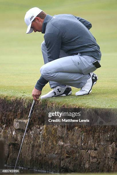 Jordan Spieth of the United States retrieves a ball from the brook during practice ahead of the 144th Open Championship at The Old Course on July 15,...