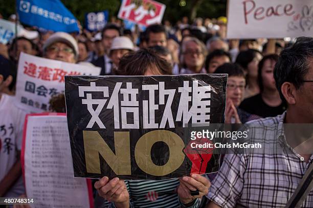 People protest outside the National Diet on July 15, 2015 in Tokyo, Japan. Protesters gathered after the ruling Liberal Democratic Party pushed the...