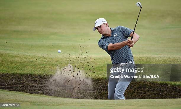 Jordan Spieth of the United States hits a shot from a greenside bunker ahead of the 144th Open Championship at The Old Course on July 15, 2015 in St...