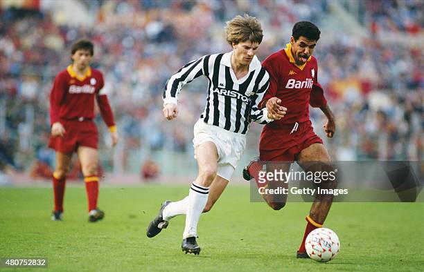 Juventus striker Michael Laudrup tussles with AS Roma defender Toninho Cerezo during a Serie A match between AS Roma and Juventus at the Olympic...