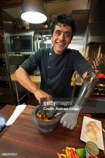 man with bionic prosthetic hand preparing food. - mt cook fotografías e imágenes de stock