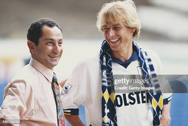 Spurs manager Osvaldo Ardiles greets new signing Jurgen Klinsmann to Tottenham Hotspur at White Hart Lane on August 4, 1994 in London, England.