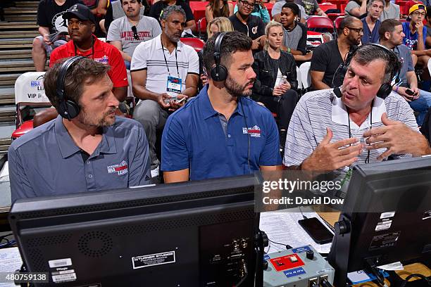 Kevin McHale head coach of the Houston Rockets speaks with Spero Dedes and Brent Barry during the 2015 NBA Las Vegas Summer League game on July 12,...