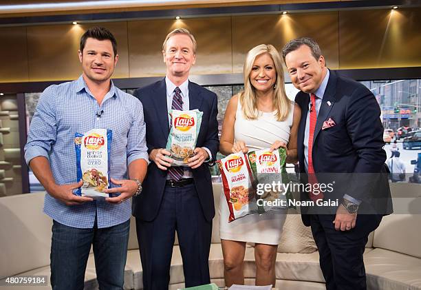 Nick Lachey, Steve Doocy, Ainsley Earhardt and Ed Henry pose on the set of 'Fox & Friends' at FOX Studios on July 15, 2015 in New York City.