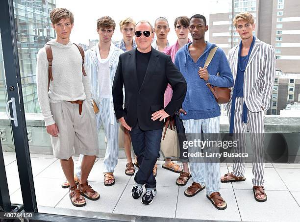 Designer Michael Kors and models pose at the Michael Kors Spring 2016 Presentation during New York Fashion Week: Men's at Spring Studios on July 15,...