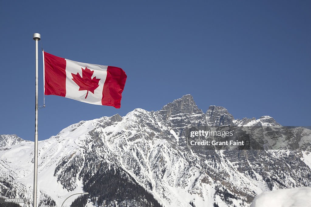 Canada flag in mountains