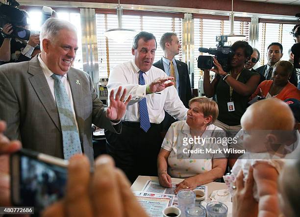 Republican presidentail candidate, New Jersey Gov. Chris Christie and Maryland Gov. Larry Hogan greet patrons during a campaign stop at the Double T...