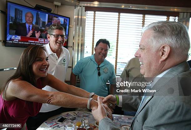 Maryland Gov. Larry Hogan greets patrons at a campaign stop with Republican presidentail candidate, New Jersey Gov. Chris Christie at the Double T...