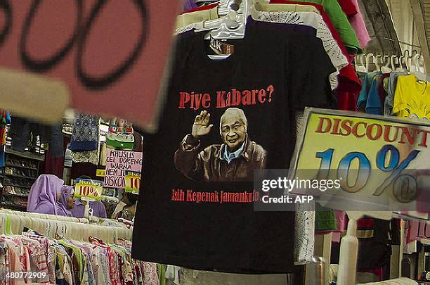 Indonesia-politics-election-Suharto,FEATURE BY OLIVIA RONDONUWU In this photograph taken on March 9 a store displays a tshirt showing the portrait of...