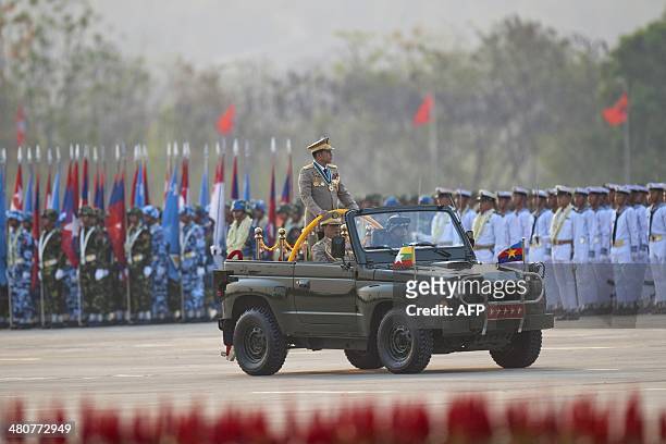 Myanmar's army chief, Senior General Min Aung Hlaing , inspects troops during a parade to mark the 69th anniversary of Armed Forces Day in Myanmar's...
