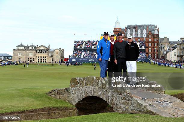 Sandy Lyle of Scotland, Sir Bob Charles of New Zealand David Duval of the United States and Justin Leonard of the United States pose on the Swilcan...