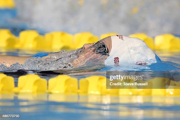 Dominique Bouchard of Canada surfaces after a turn in the 200 backstroke in the preliminaries of the the second day of the swimming competition at...