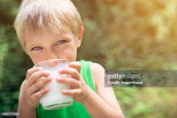 little boy drinking milk - boy drinking milk stock pictures, royalty-free photos & images