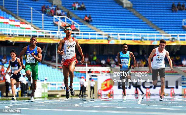 Abdul Hakim Sani Brown of Japan finishes first in heat one of the Boys 100 Meters on day one of the IAAF World Youth Championships Cali 2015 on July...
